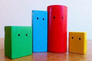 Blocks of different shapes and colors illustrate geometry and Assistive Technology for the Blind